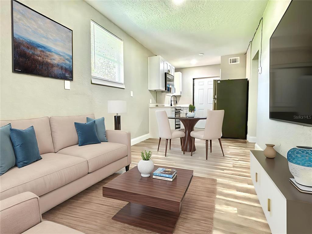 418 Charles Street Winter Garden, FL 34787 - Photo 26 of 35 a living room with furniture and a flat screen tv