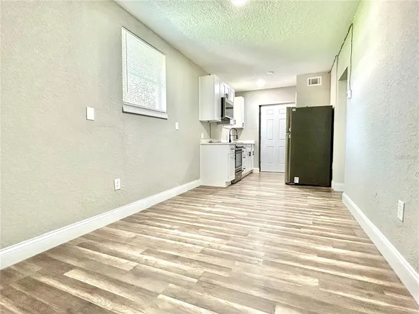 a view of a bedroom with a furniture and a window