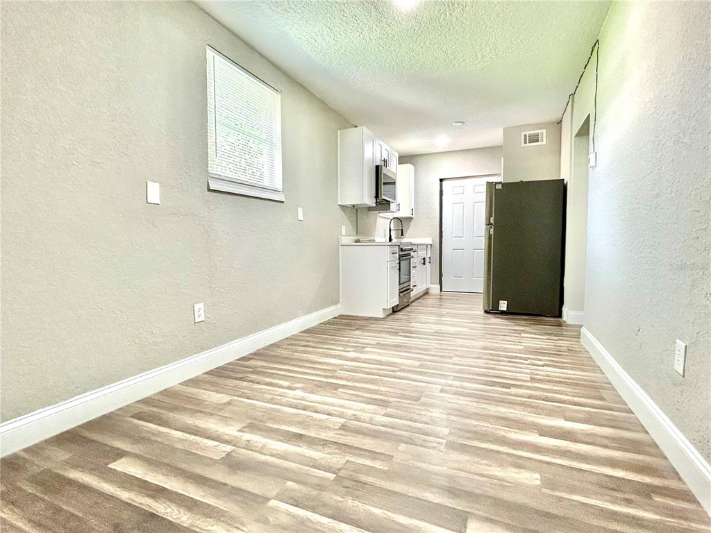 418 Charles Street Winter Garden, FL 34787 - Photo 27 of 35 a view of a bedroom with a furniture and a window