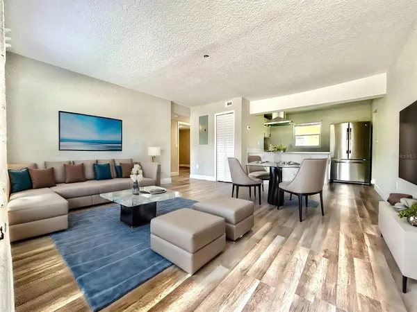 a living room with furniture and a table