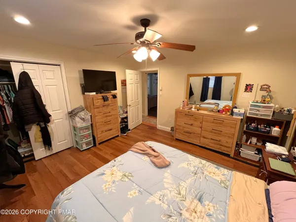 a bedroom with a bed and furniture