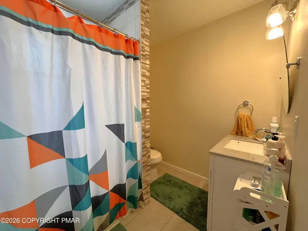 a bathroom with a sink and toilet