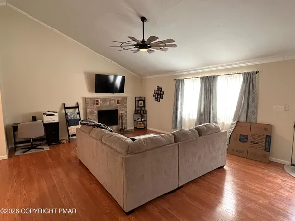 a living room with furniture and a flat screen tv