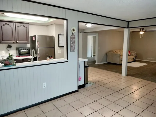 a bathroom with a double vanity sink toilet and shower