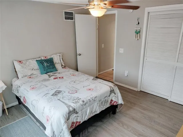 a view of a room with wooden floors and a window