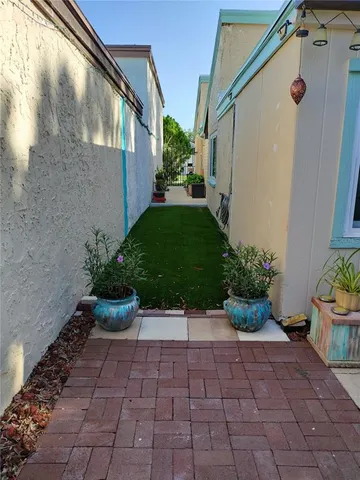 a bed room with a bed and a potted plant