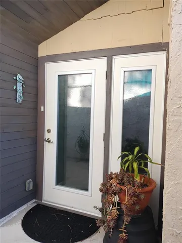 a kitchen with stainless steel appliances kitchen island granite countertop a sink and cabinets