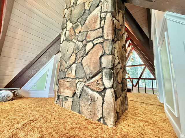 12498 East Wilderness Road Brighton, UT 84121 - Photo 34 of 40 Stone-clad column with exposed beams and an attic window
