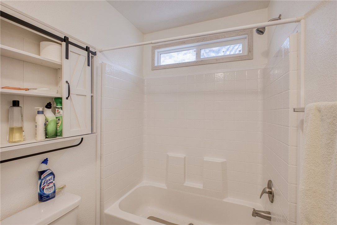 1855 Talc Road Bullhead City, AZ 86442 - Photo 13 of 23 Bathroom featuring washtub / shower combination and toilet