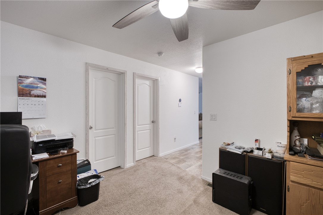 1855 Talc Road Bullhead City, AZ 86442 - Photo 15 of 23 Office with a ceiling fan and light carpet