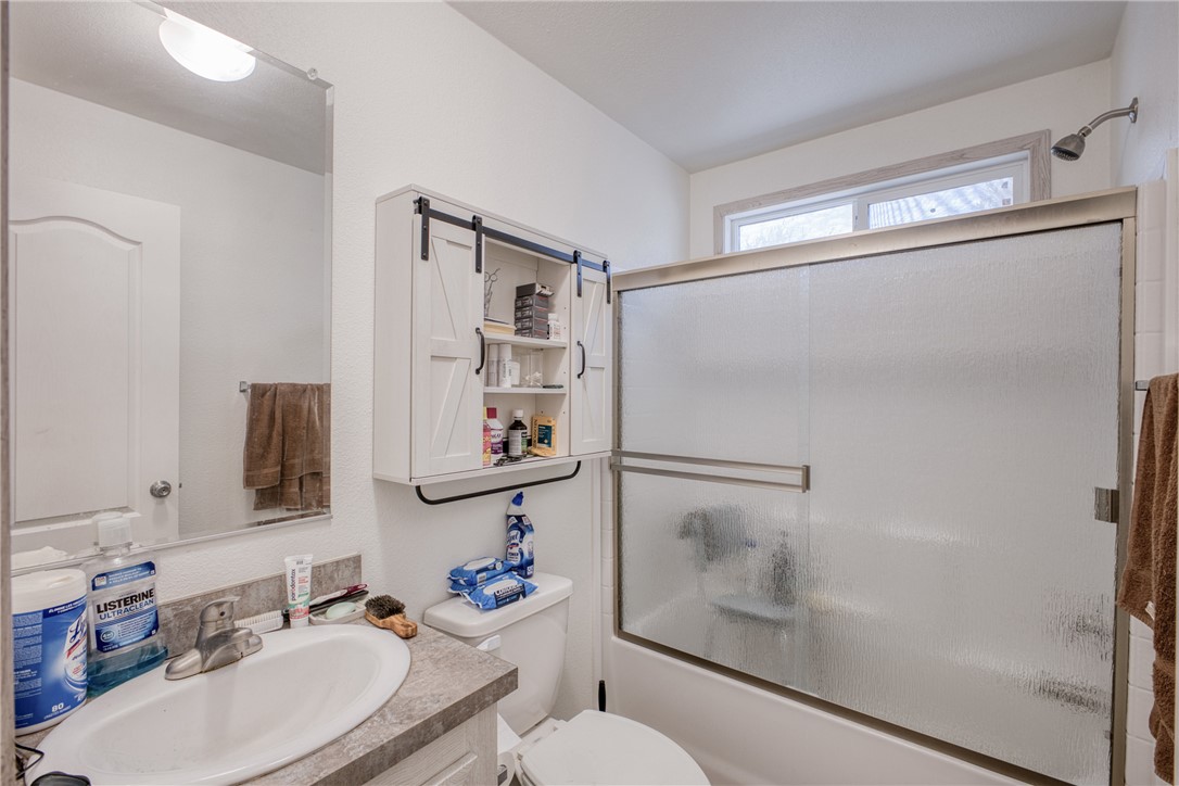 1855 Talc Road Bullhead City, AZ 86442 - Photo 20 of 23 Bathroom featuring vanity and enclosed tub / shower combo