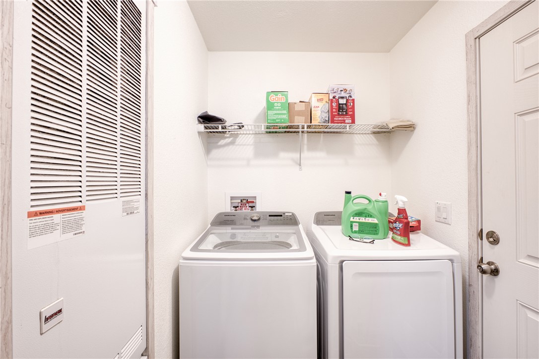 1855 Talc Road Bullhead City, AZ 86442 - Photo 22 of 23 Laundry area featuring a heating unit and separate washer and dryer
