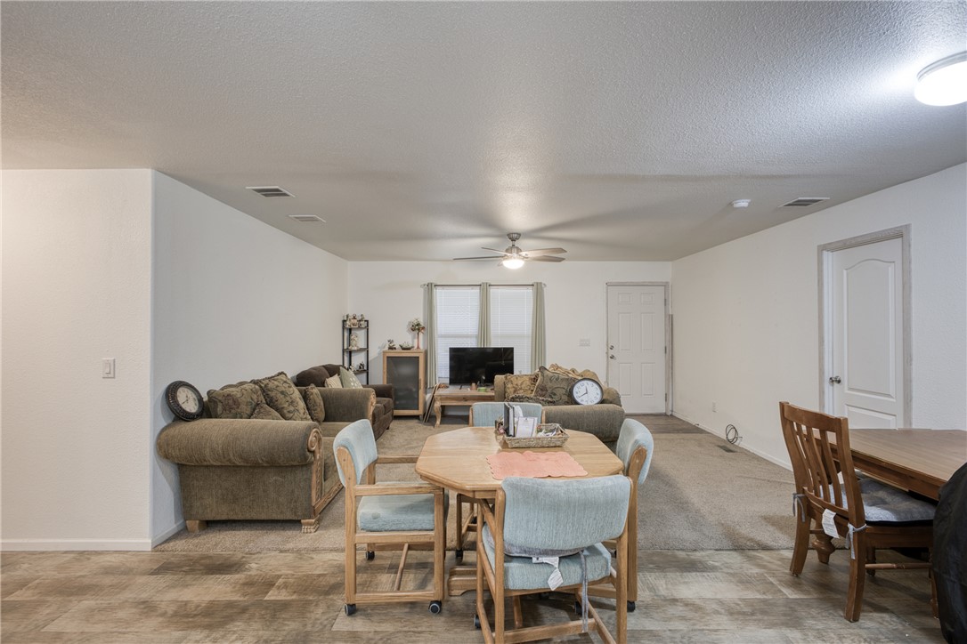 1855 Talc Road Bullhead City, AZ 86442 - Photo 7 of 23 Dining space featuring a textured ceiling and ceiling fan