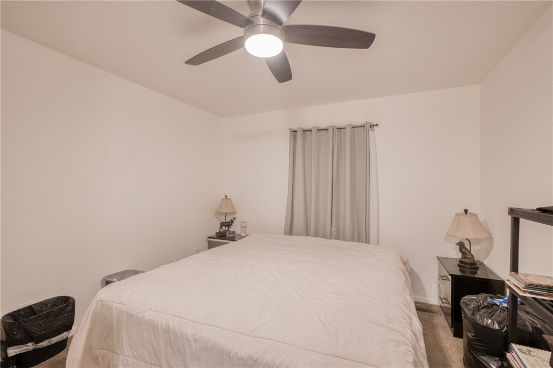 1855 Talc Road Bullhead City, AZ 86442 - Photo 10 of 23 Bedroom featuring carpet floors and a ceiling fan