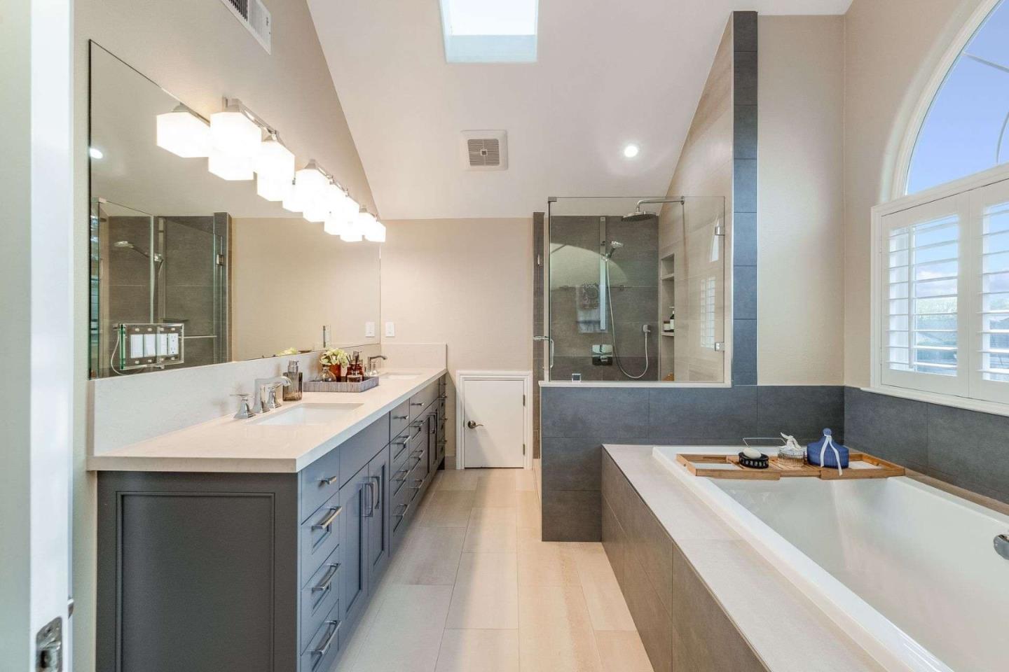 735 Sleeper Avenue Mountain View, CA 94040 - Photo 36 of 77 a bathroom with a sink double vanity granite tub shower and a mirror