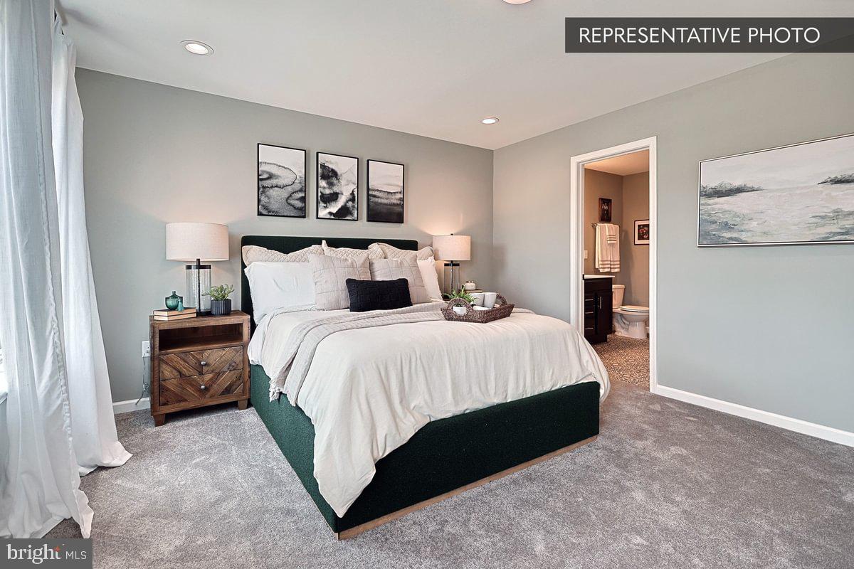 Sweet Birch Plan At Hills Spring Grove, PA 17362 - Photo 24 of 47 a bedroom with a bed and painting on the wall