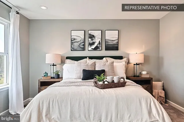 a bedroom with a bed and lamp