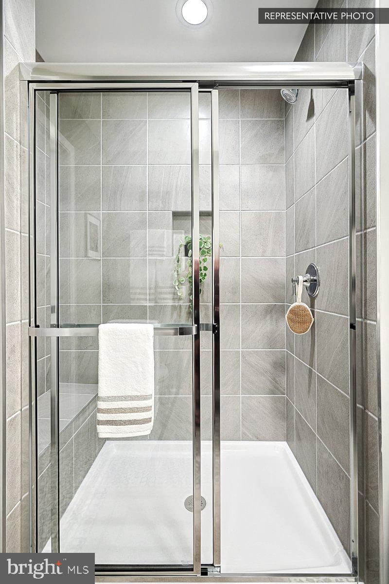 Sweet Birch Plan At Hills Spring Grove, PA 17362 - Photo 28 of 47 a bathroom with a shower and a sink