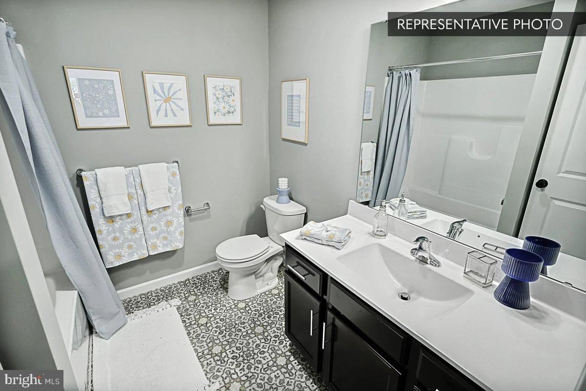 Sweet Birch Plan At Hills Spring Grove, PA 17362 - Photo 32 of 47 a bathroom with a sink a toilet and mirror