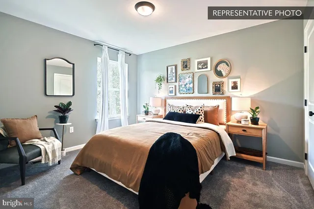 a bedroom with a bed and a potted plant