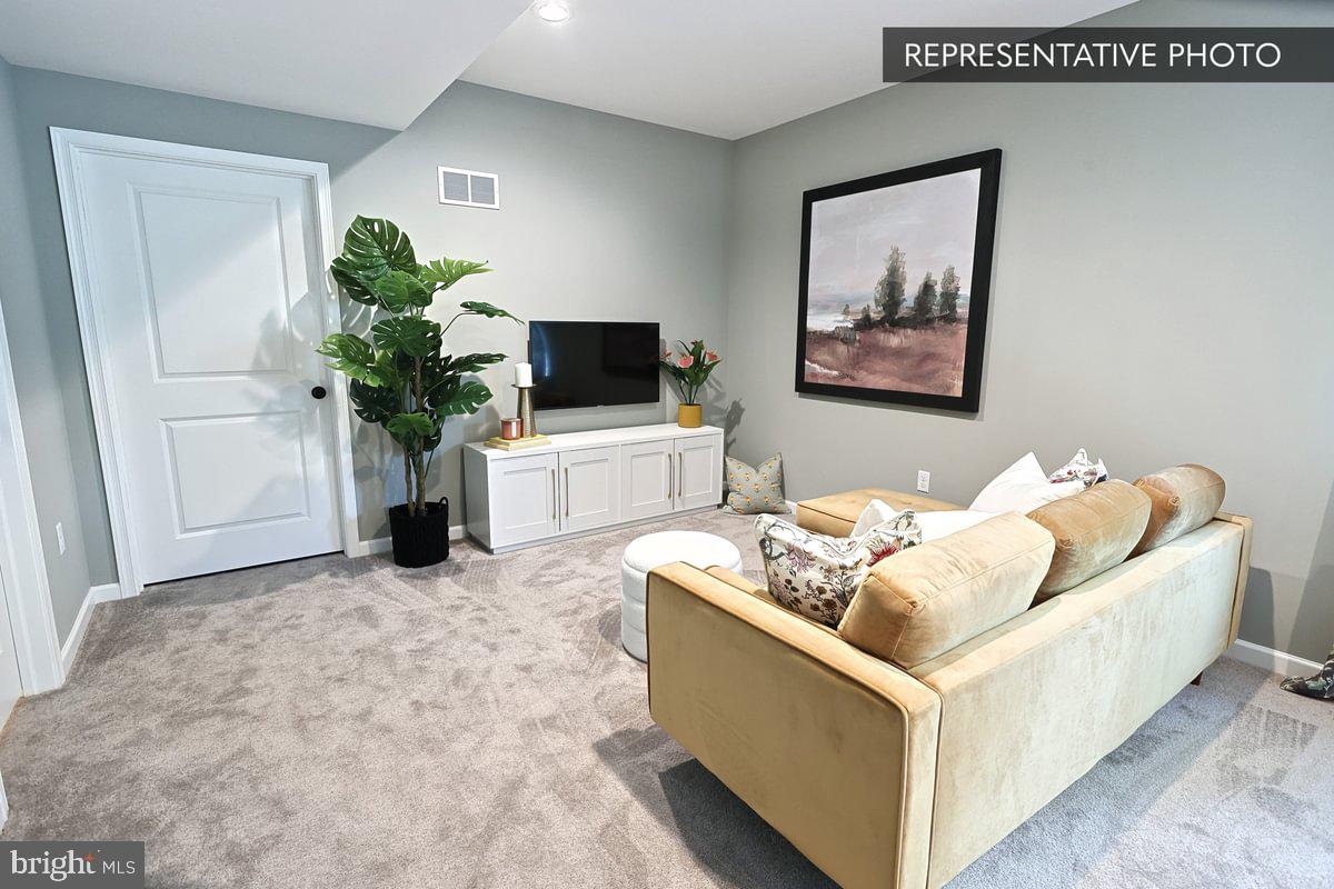 Sweet Birch Plan At Hills Spring Grove, PA 17362 - Photo 42 of 47 a living room with furniture and a flat screen tv