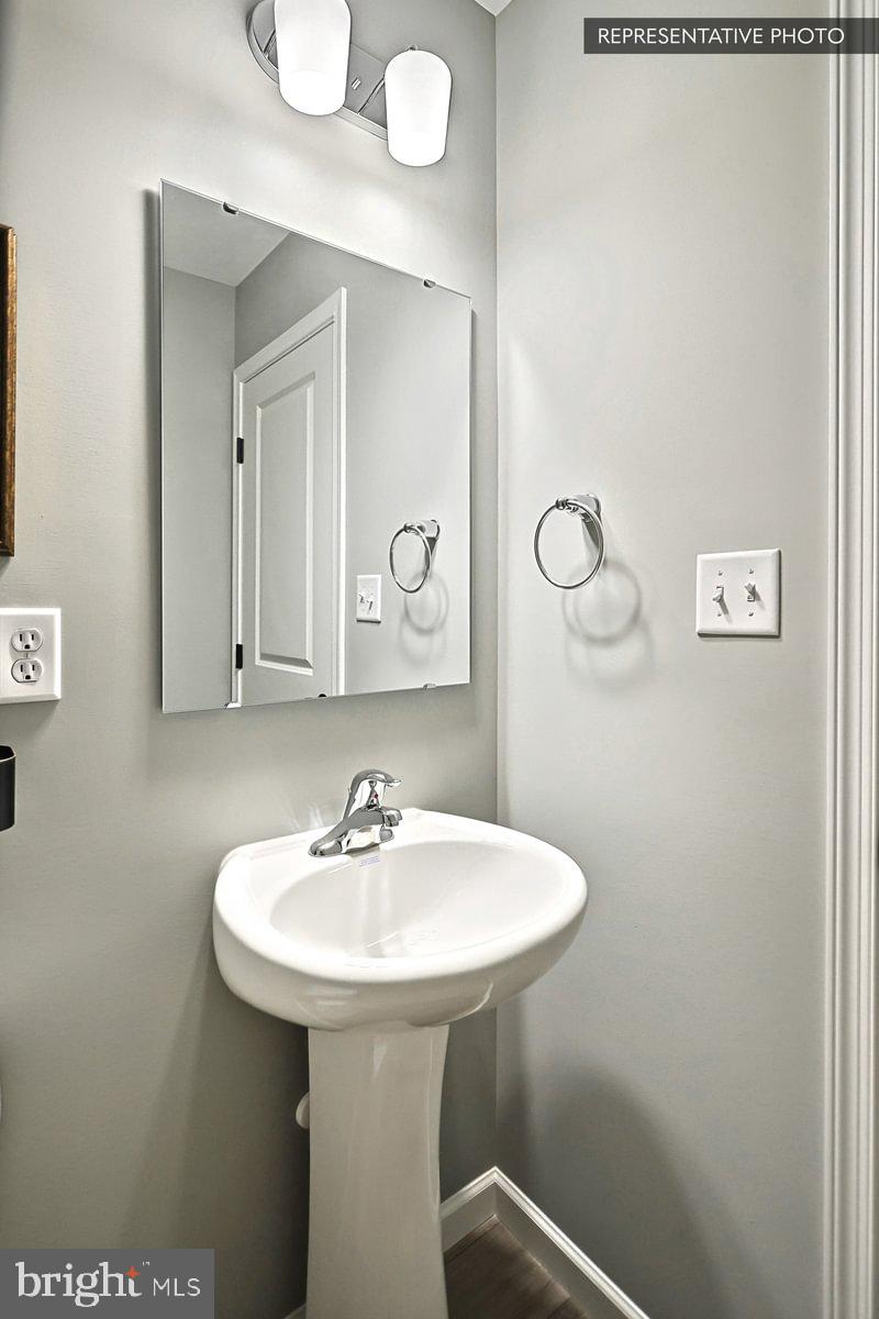 Sweet Birch Plan At Hills Spring Grove, PA 17362 - Photo 9 of 47 a bathroom with a sink a mirror and shower