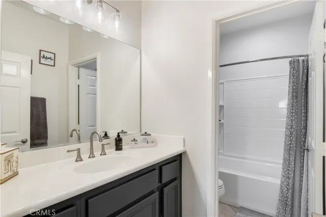 a bathroom with a double vanity sink mirror and double