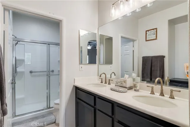 a bathroom with a double vanity sink mirror and double