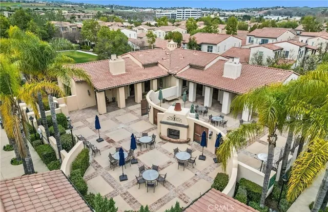 an aerial view of a house with yard