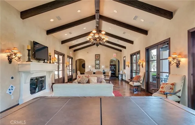 a living room with fireplace furniture and a fireplace