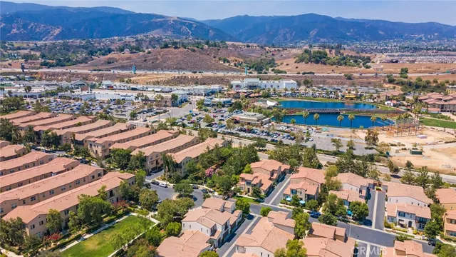 an aerial view of residential houses and outdoor space