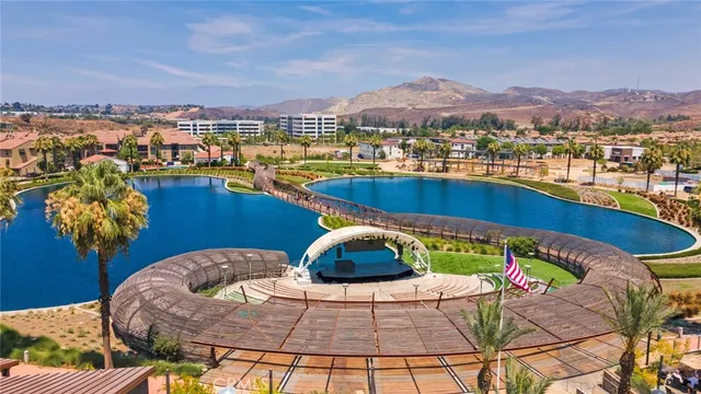 a view of a swimming pool with a table and chairs
