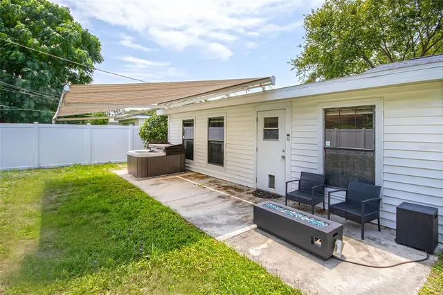 a backyard of a house with seating space