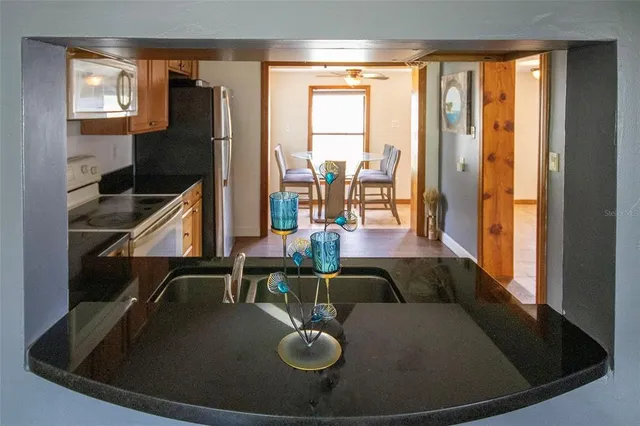 a view of dining room with floor to ceiling window and hardwood floor