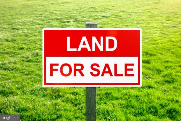 0 George Avenue Millville, NJ 08332 - Photo 1 of 1 a sign that is sitting on a lush green field