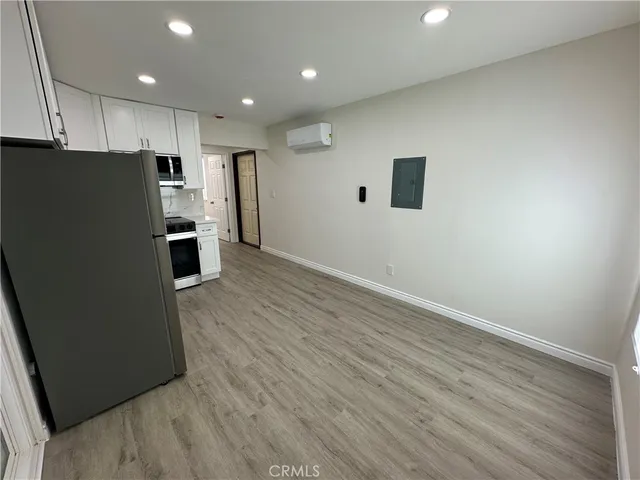a view of kitchen with wooden floor