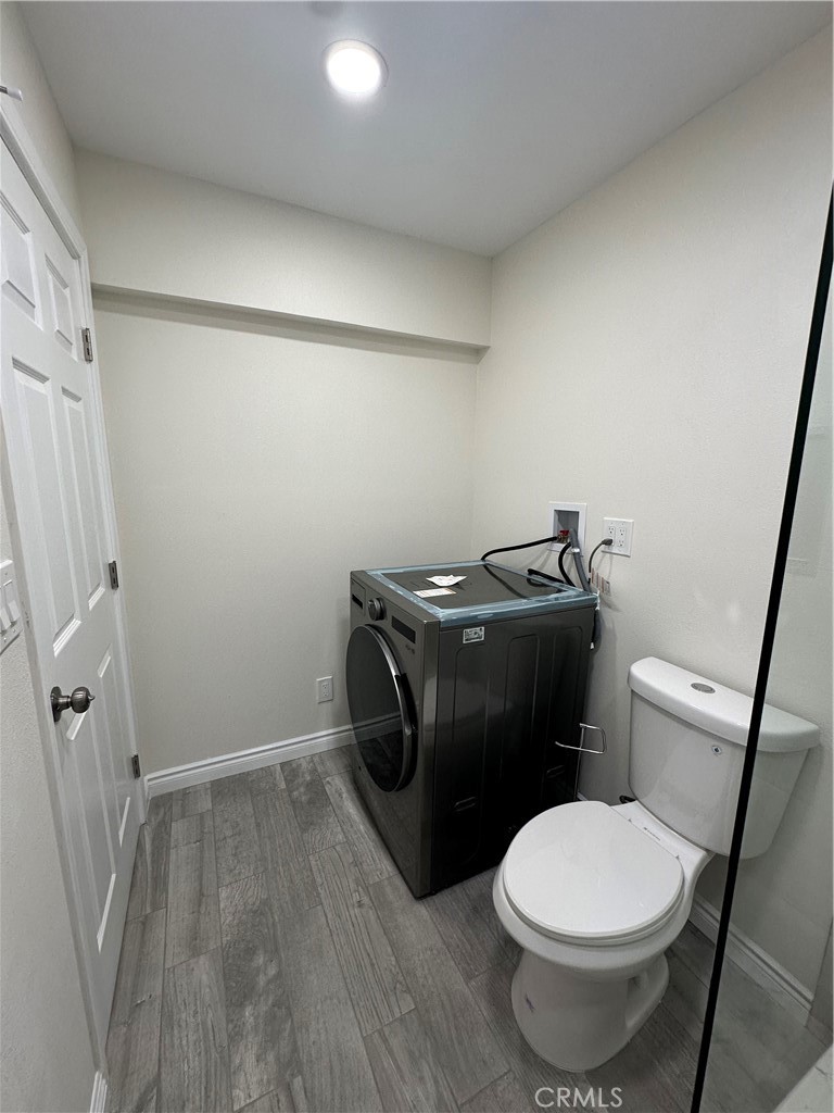 20655 Lemmer Street Chatsworth, CA 91311 - Photo 19 of 25 a white toilet sitting next to a small sink
