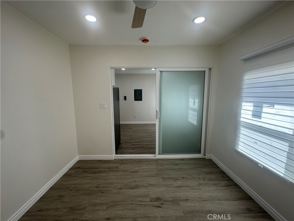 20655 Lemmer Street Chatsworth, CA 91311 - Photo 4 of 25 an empty room with wooden floor and windows