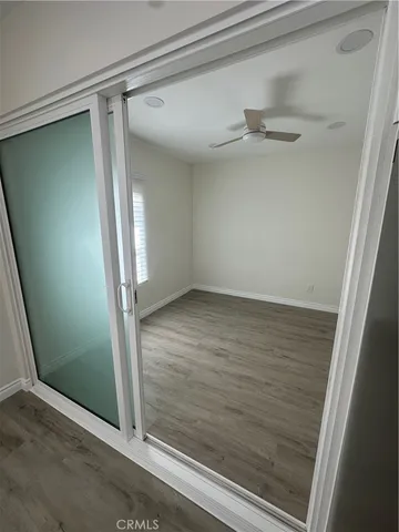 an empty room with wooden floor