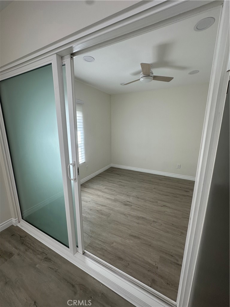 20655 Lemmer Street Chatsworth, CA 91311 - Photo 9 of 25 an empty room with wooden floor