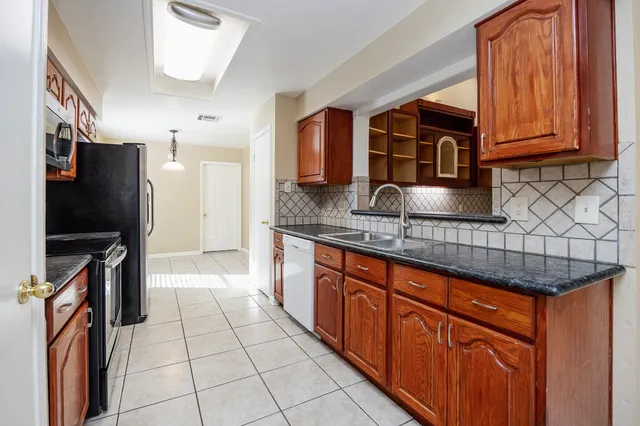 a bathroom with a sink vanity and mirror