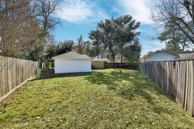 a bathroom with a shower a toilet and a shower