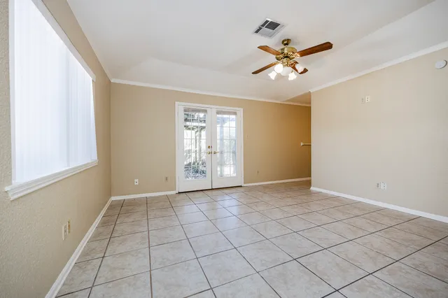 a view of walk in closet with empty racks