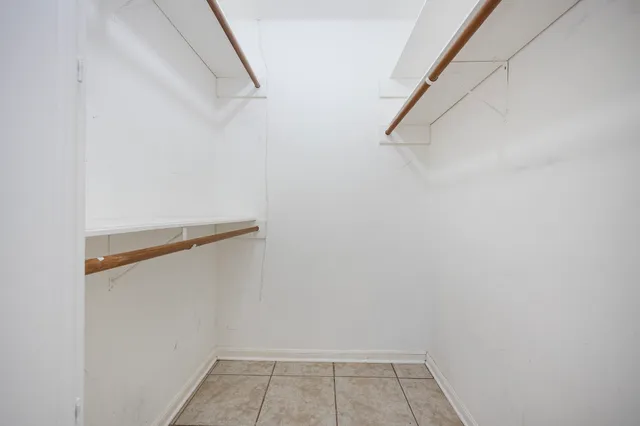 a white bath tub sitting next to a toilet