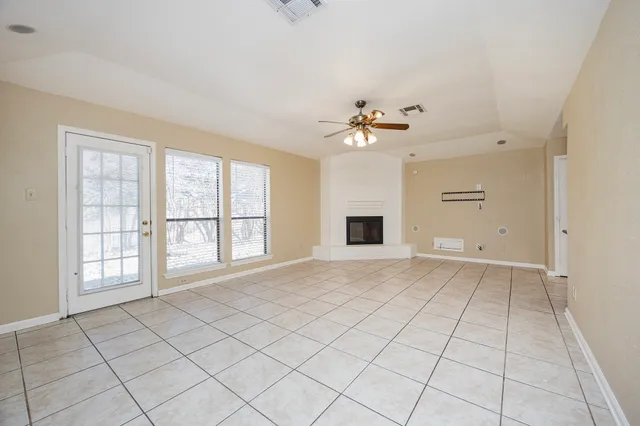 a view of an empty room with a window