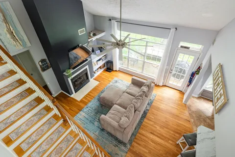 a bedroom with furniture and a large window