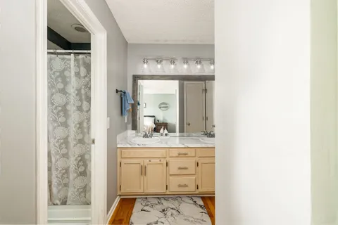 a bathroom with a sink and a mirror