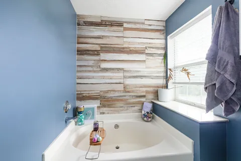 a bathroom with a bathtub and a sink