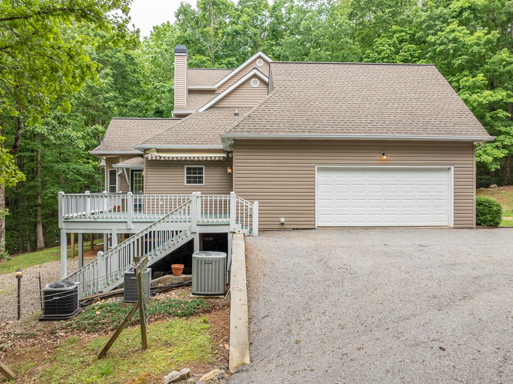 399 Hideaway Hills Road Blairsville, GA 30512 - Photo 11 of 77 a view of house and outdoor space with yard
