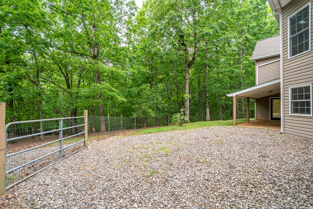 399 Hideaway Hills Road Blairsville, GA 30512 - Photo 13 of 77 a view of a backyard with a tv